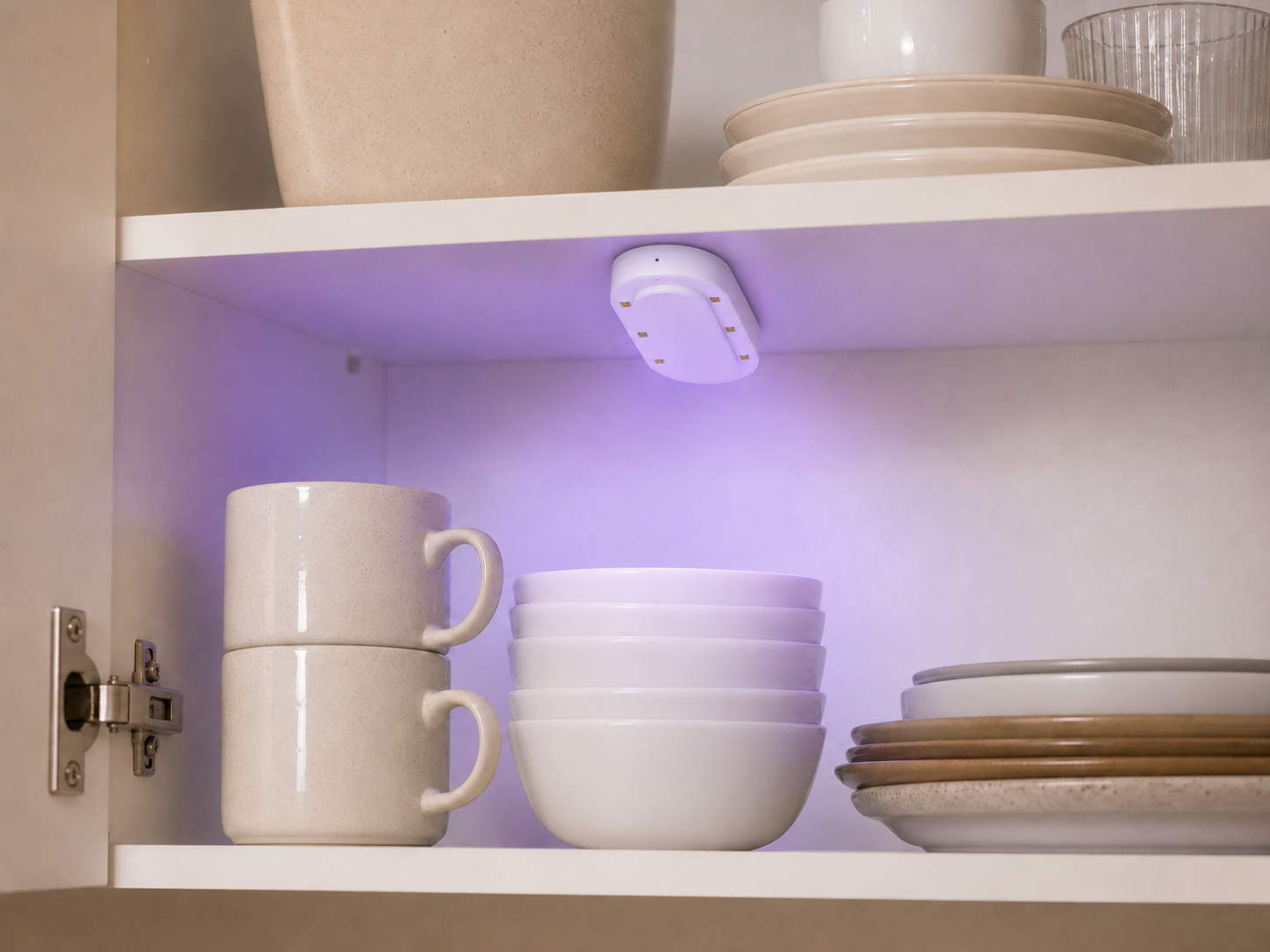 Azuremist refresh device mounted inside a cupboard with stacked dishes